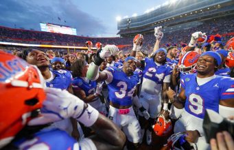 The Florida Gators celebrate the win over Texas after the game- 1280x853